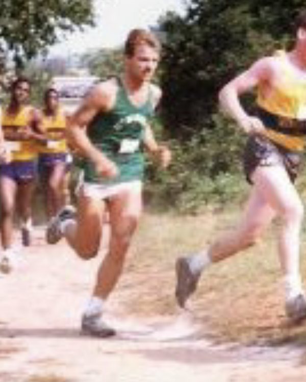 Will Power running a college cross-country race in a green jersey