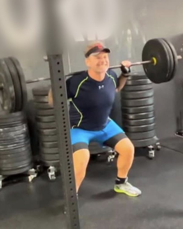 Will Power doing a barbell front squat at a CrossFit gym